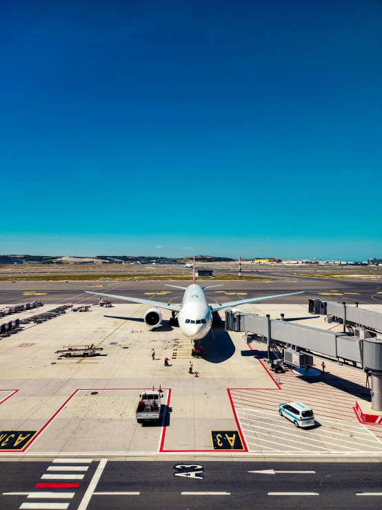 a big white airplane parked at an airport