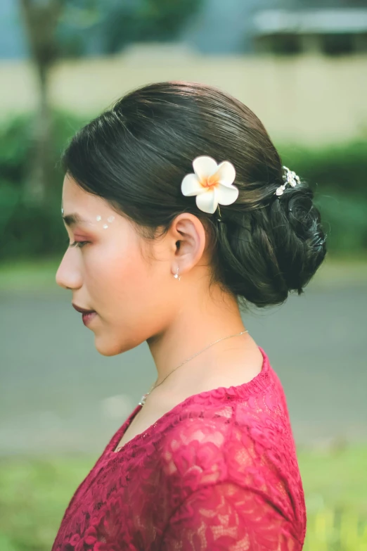 a woman with a flower in her hair