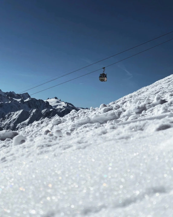 someone riding their skis on a snowy slope