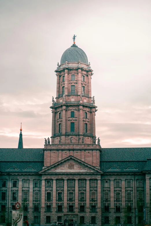 a large brick building with a large spire