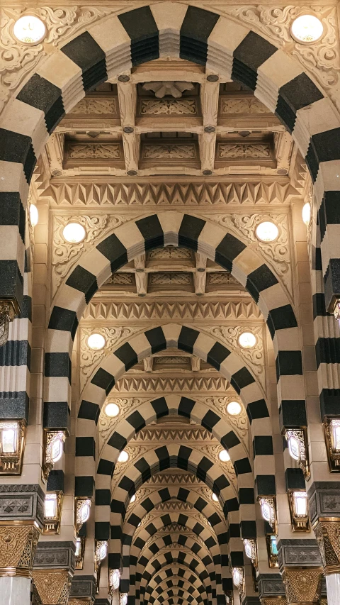 a view of the top ceiling of a building that is decorated with black and white stripes