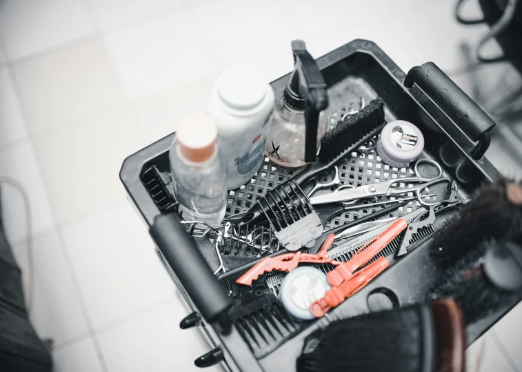 scissors, combs and hair products on top of the table