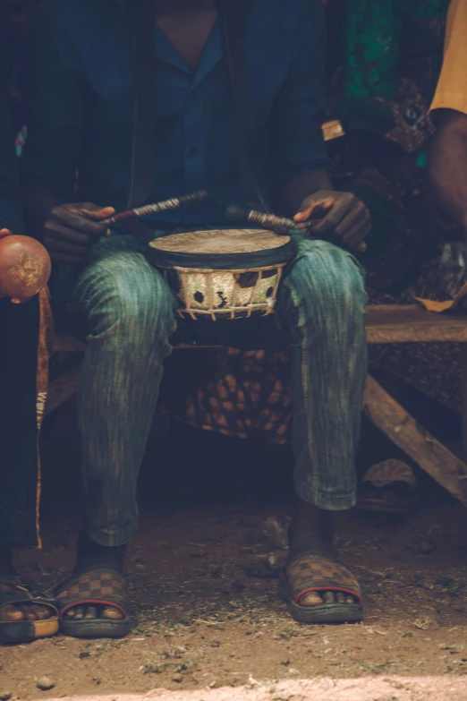 a person that is sitting down with a basket on their lap