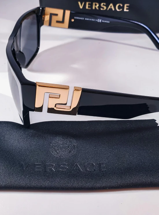 versa sunglasses, featuring gold and black accents