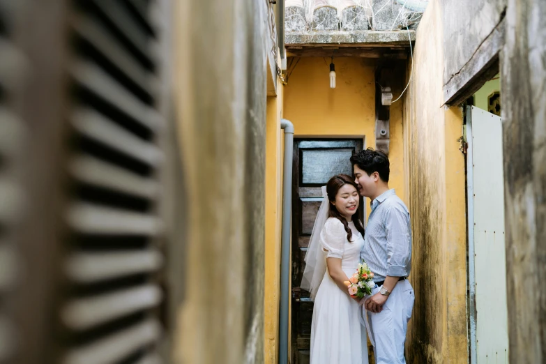 a man and woman standing in an alley together