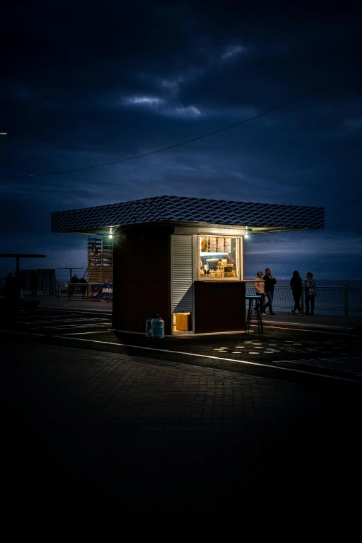 a small wooden cabin in front of the ocean