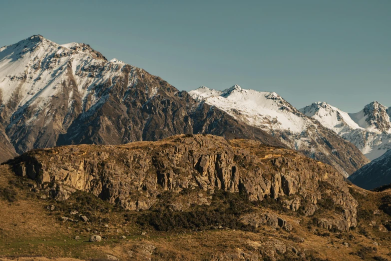 two mountains with a sky background