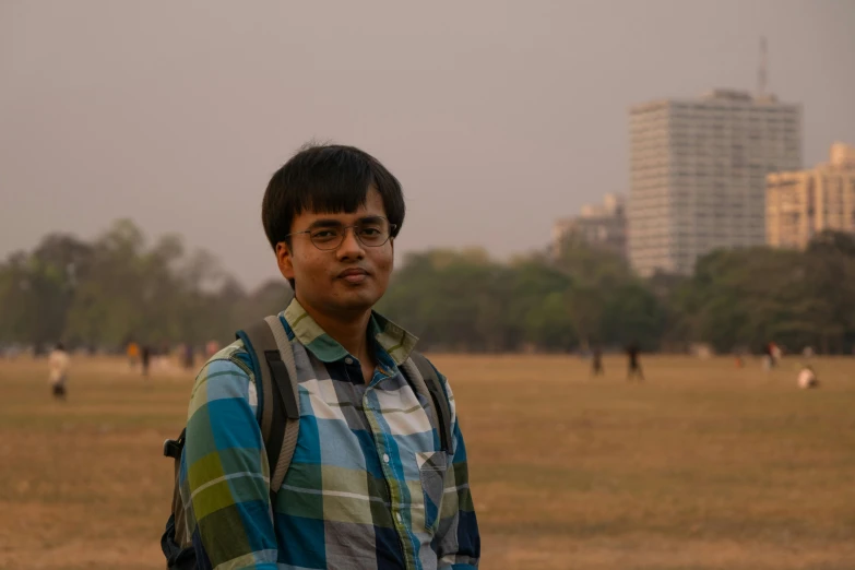 a man with a backpack posing for a po