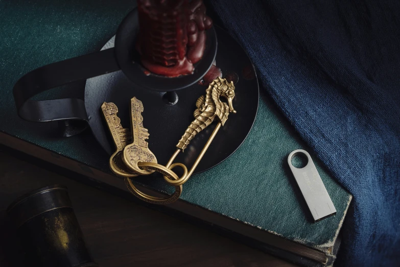 the gold metal objects are next to the bottle opener