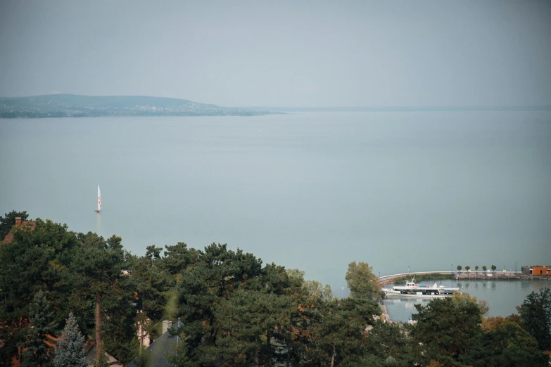 an airplane is flying over a beautiful lake