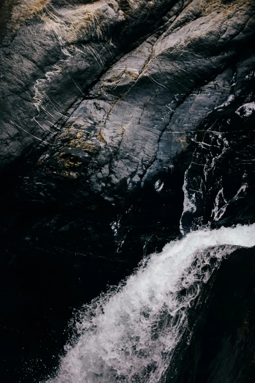 water pouring out of a small, rocky creek