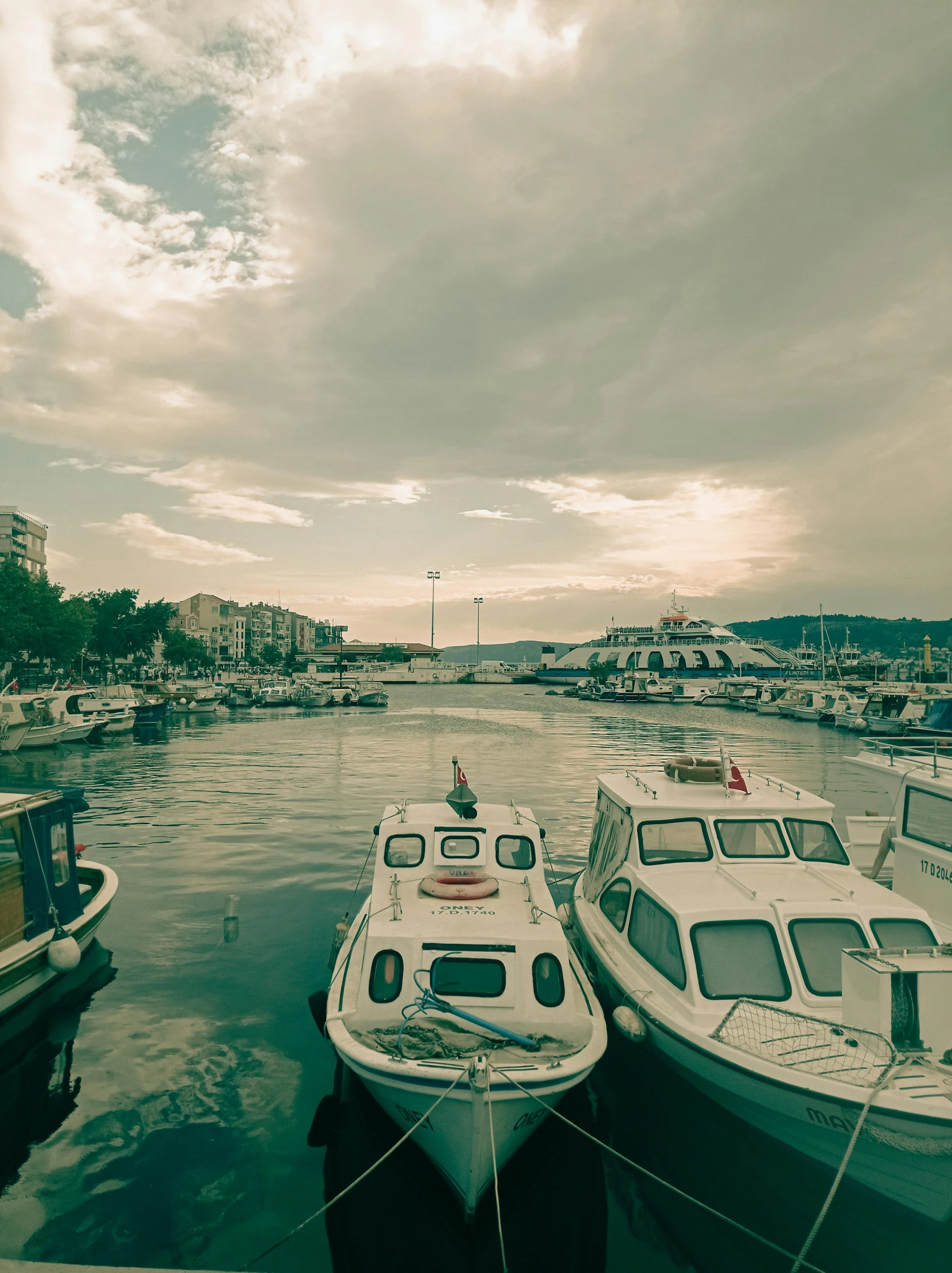 several boats sitting docked at a harbor in the water