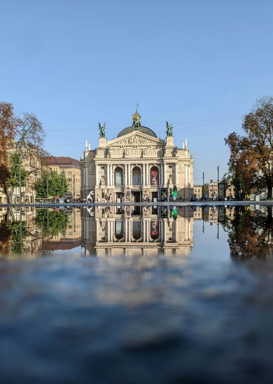 people are standing in front of an elaborate building