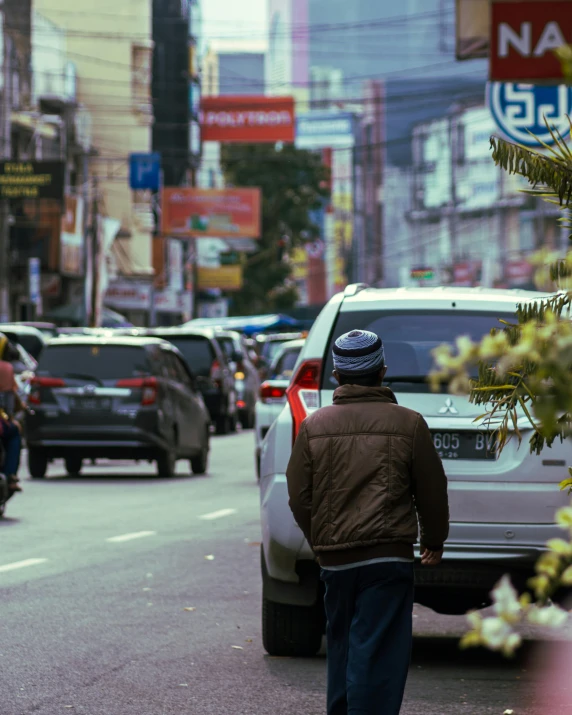 a man walking in the middle of a street