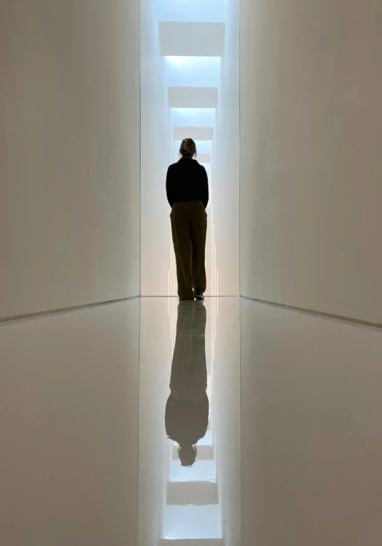 a man standing in the middle of an open building