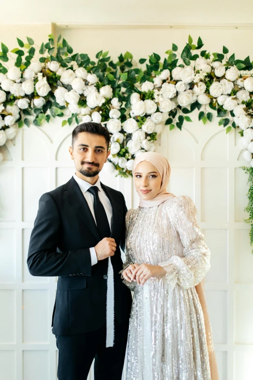 a bride and groom pose for pictures