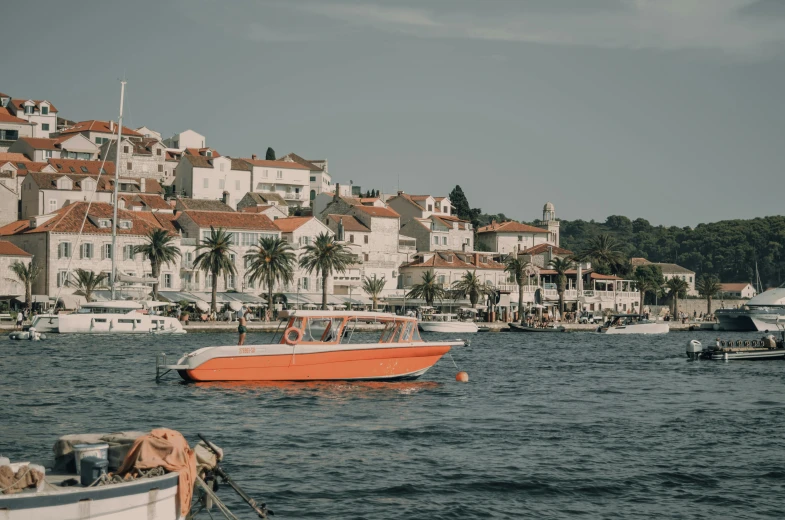 the boats are tied up in the harbor