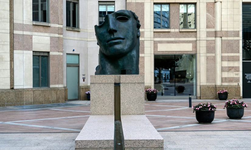 a bustural face is shown in a courtyard