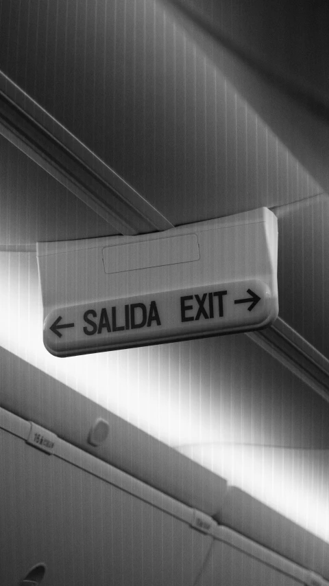 a black and white po of a exit sign