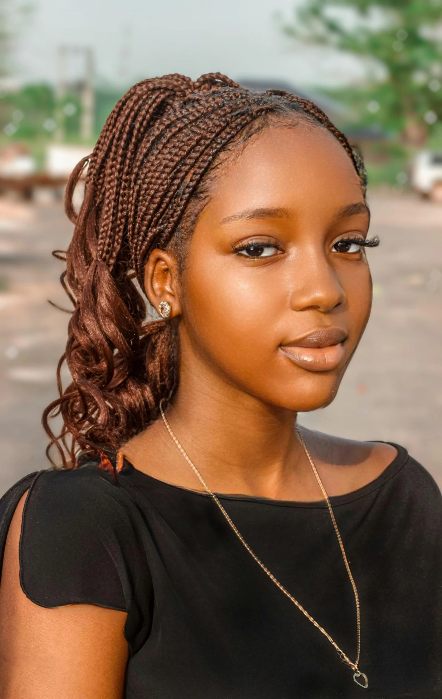 young woman with ids and black top