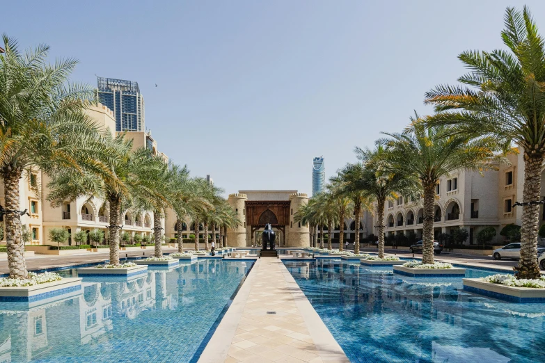 a walkway over a large blue pool filled with water