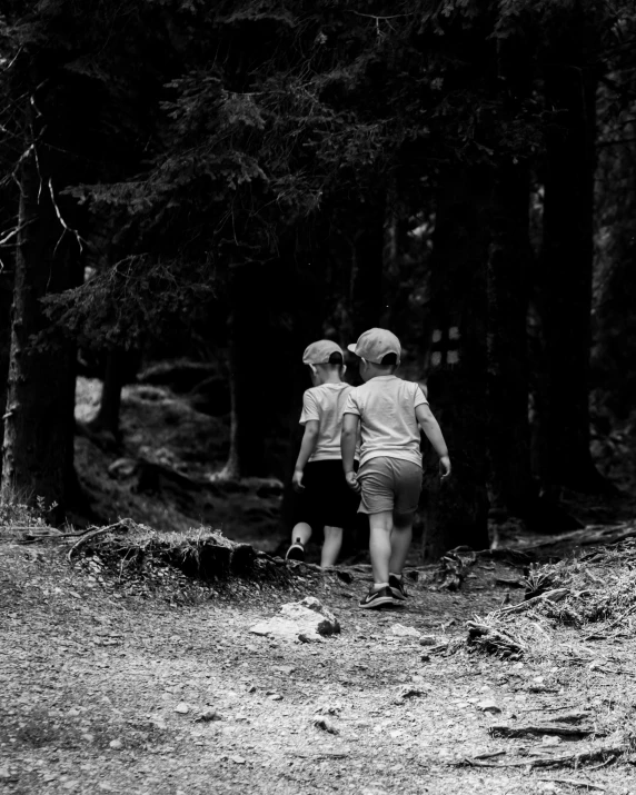 a couple of s walking in the woods