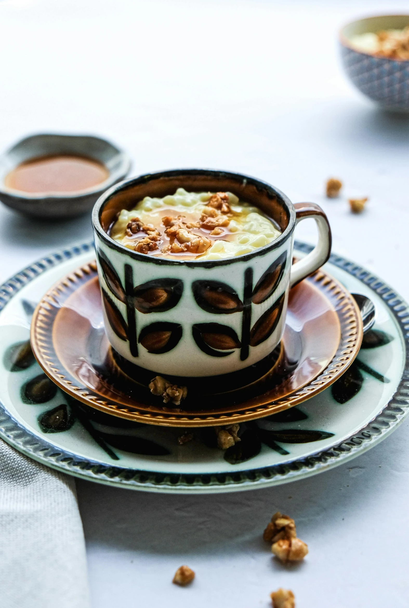 a plate with a cup of food on it