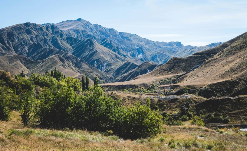 a landscape image of mountains, valleys and forest