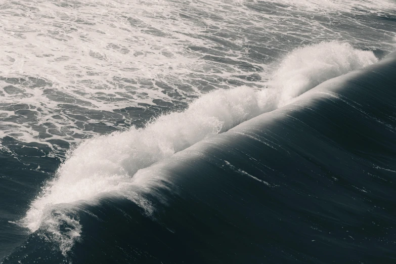 the water waves on top of the large wave