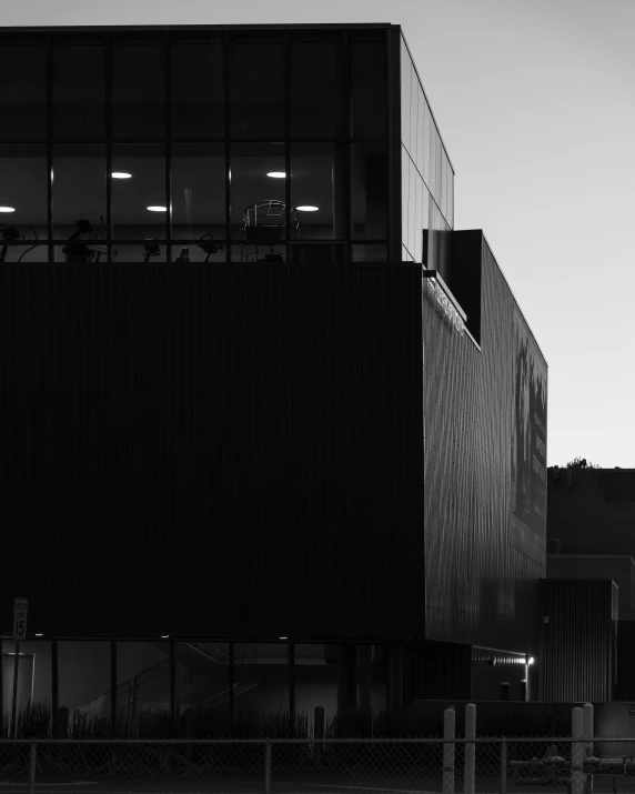 the black and white pograph shows a building with windows