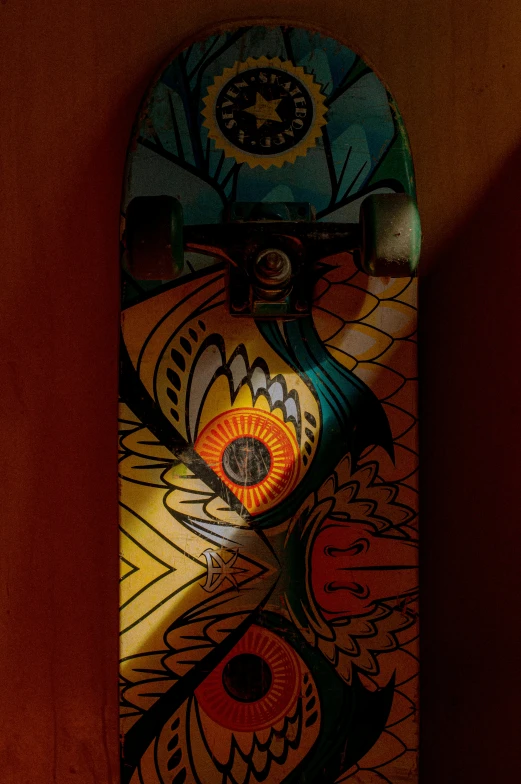 a skateboard is displayed against a dark wall