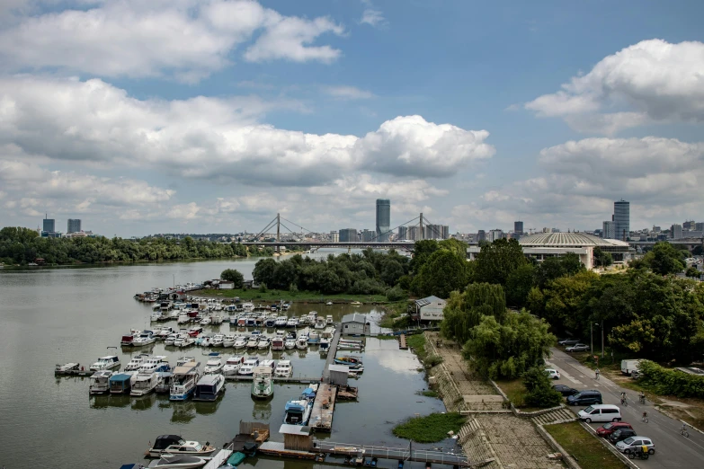 a dock with lots of small boats on a river