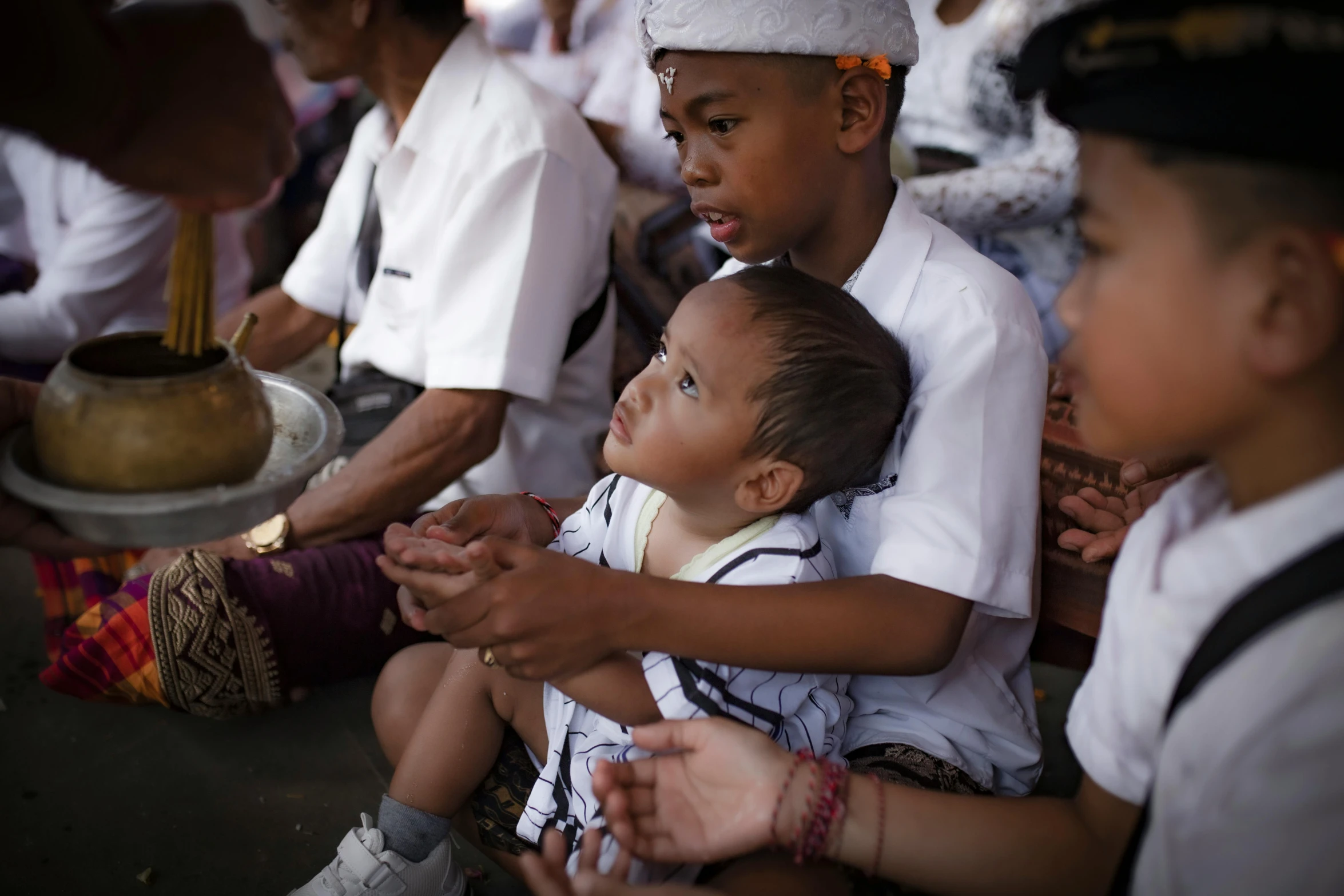 children waiting in line to be given some food