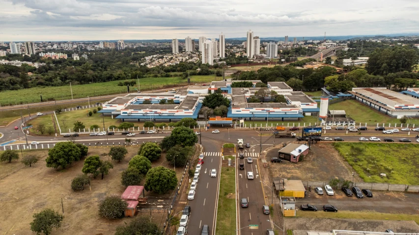 a city scene with a bus station and cars