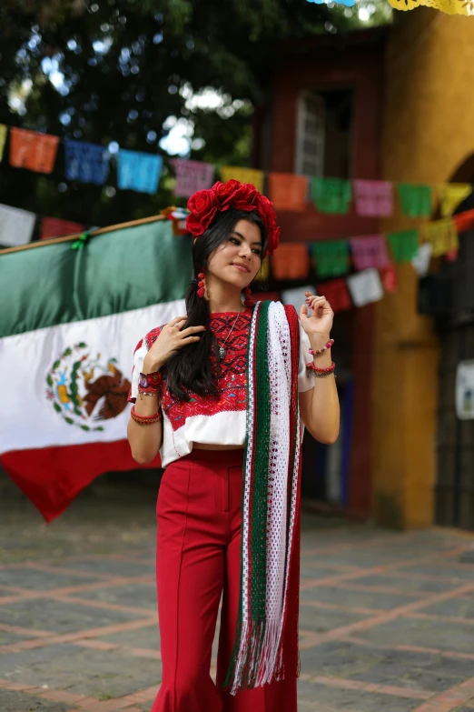 an attractive lady in mexican dress with flag hanging from clothes line