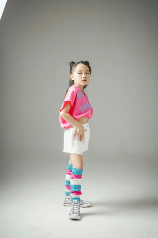 a little girl posing for a pograph in the studio