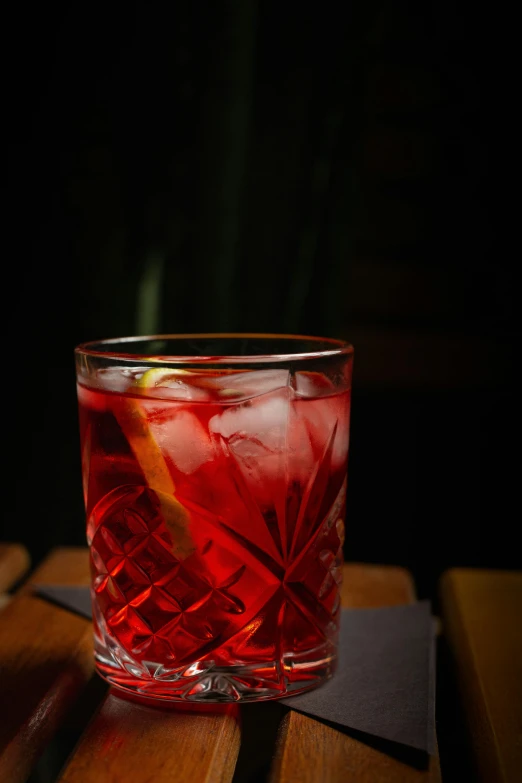 a drink in a glass is sitting on the table