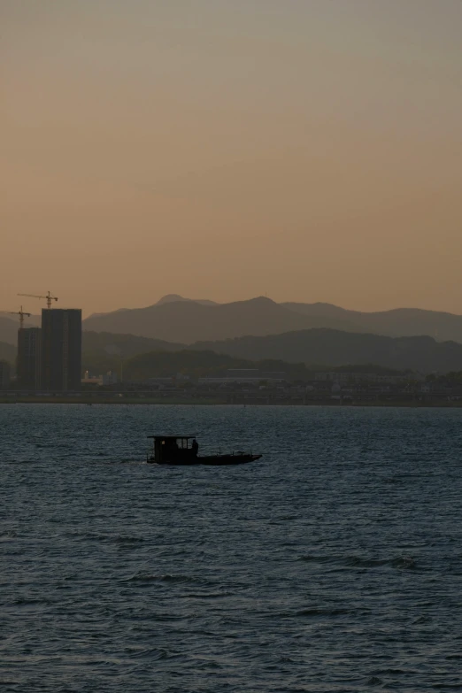 an image of a small boat out in the ocean