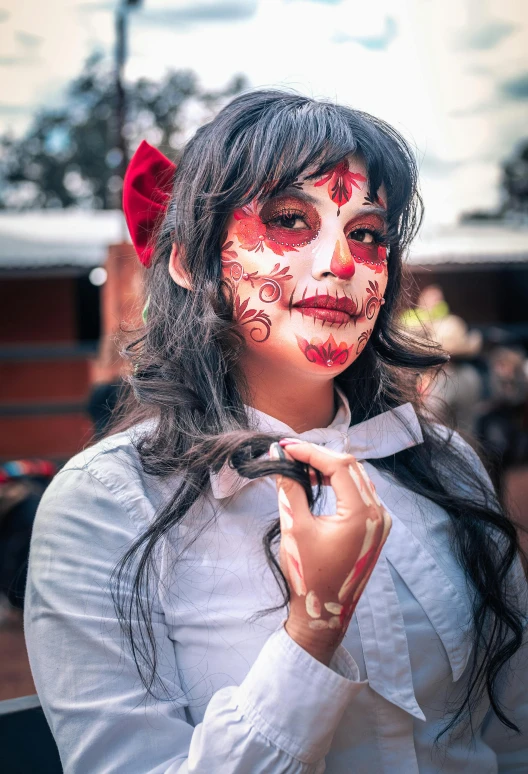 woman in costume holding a cane and looking down