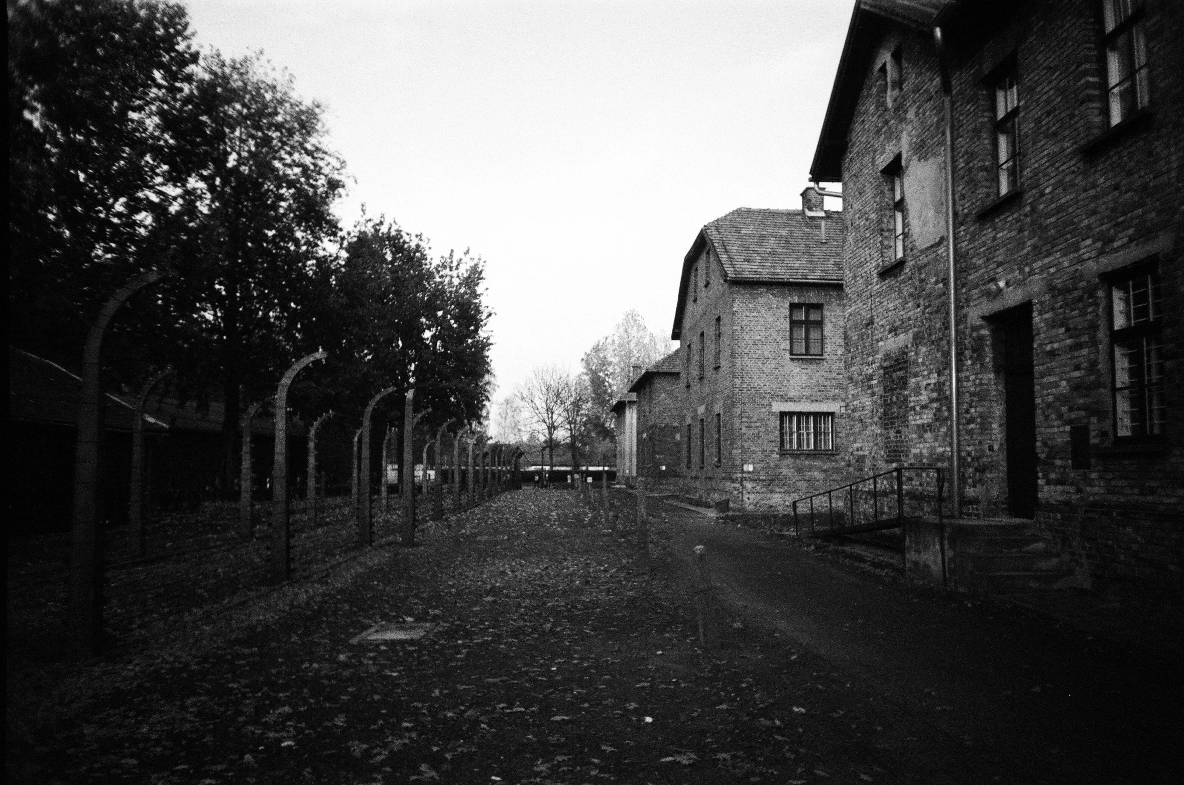 an old building with a clock on the front and side of it