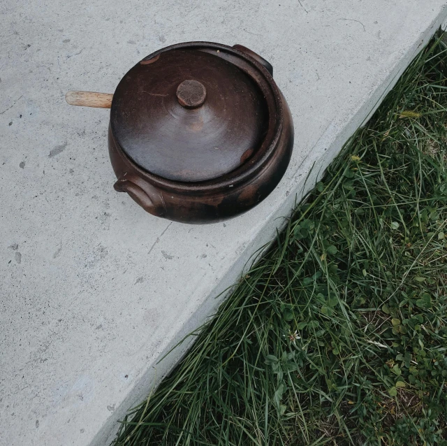 a small pot that is sitting in the concrete