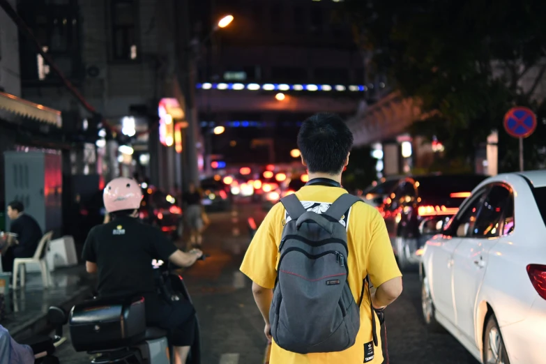 a person is walking across a busy street