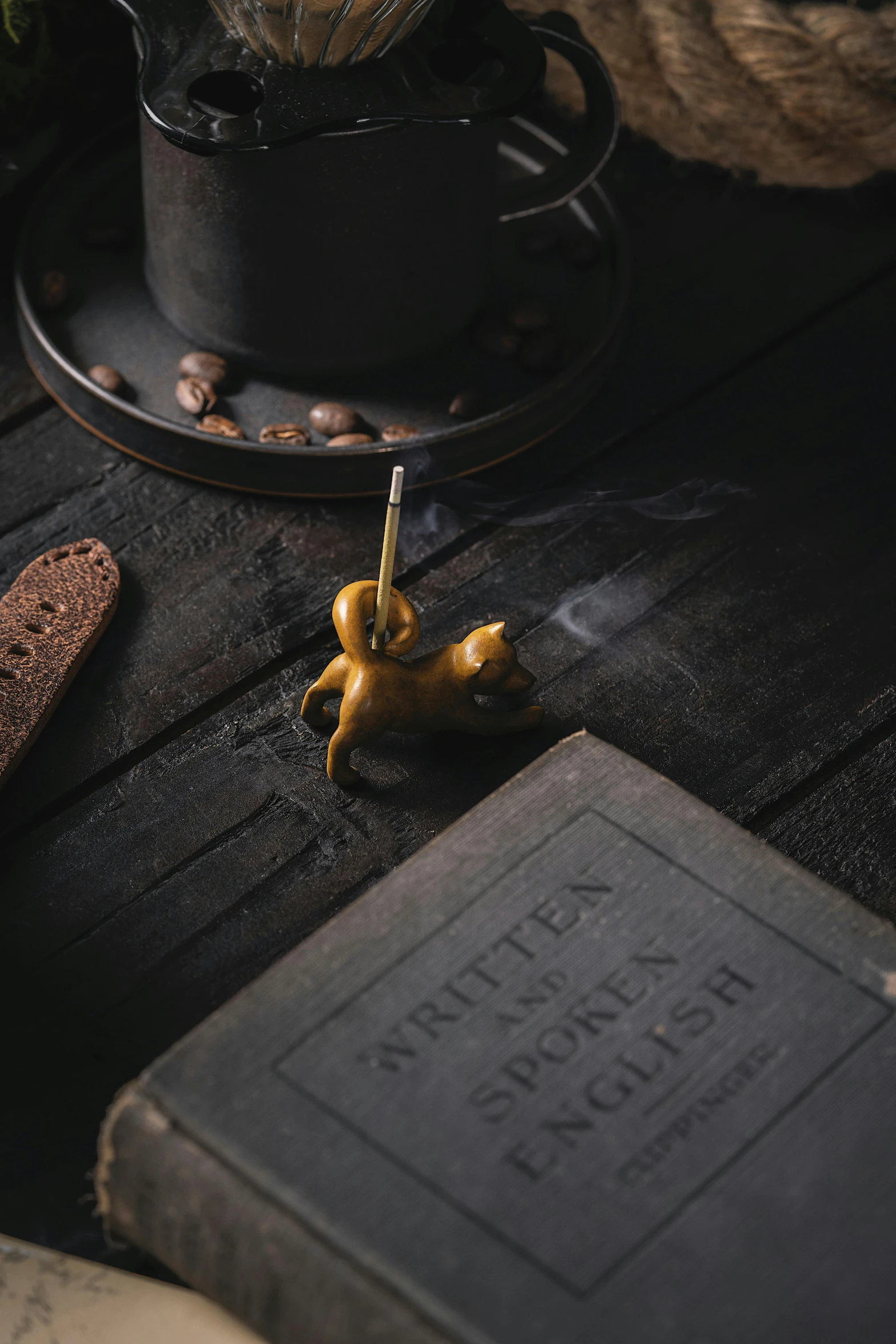 the doll bear is lying on the old book