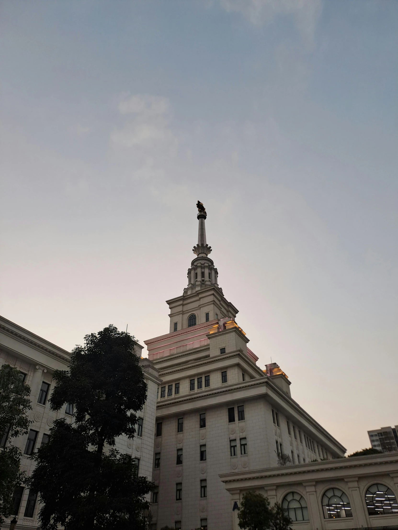 the top of a large building with a clock on it