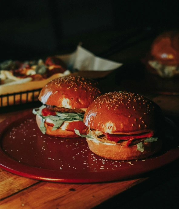 two sandwiches sitting on top of a red tray