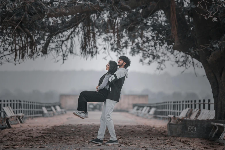 a man is holding a woman on his back