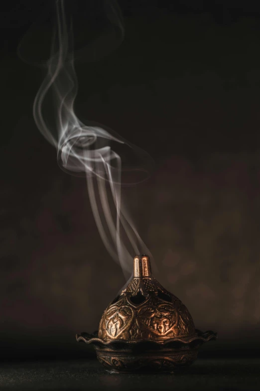 a bottle filled with smoke sitting on top of a table