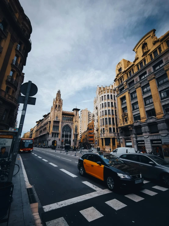 a city street is filled with cars and buildings