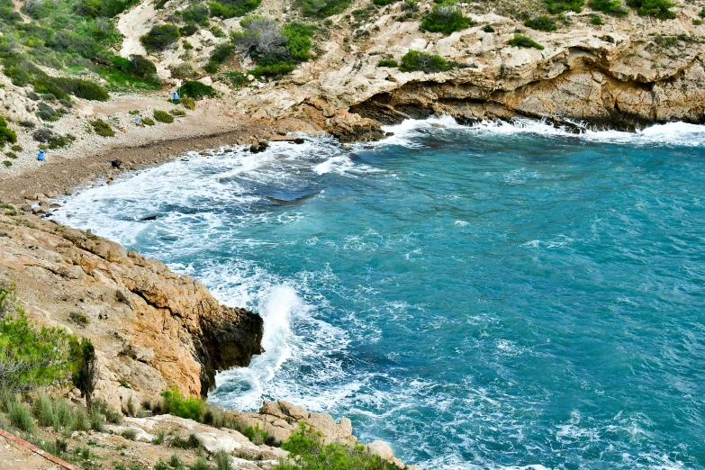 view from top of cliff looking over to ocean area