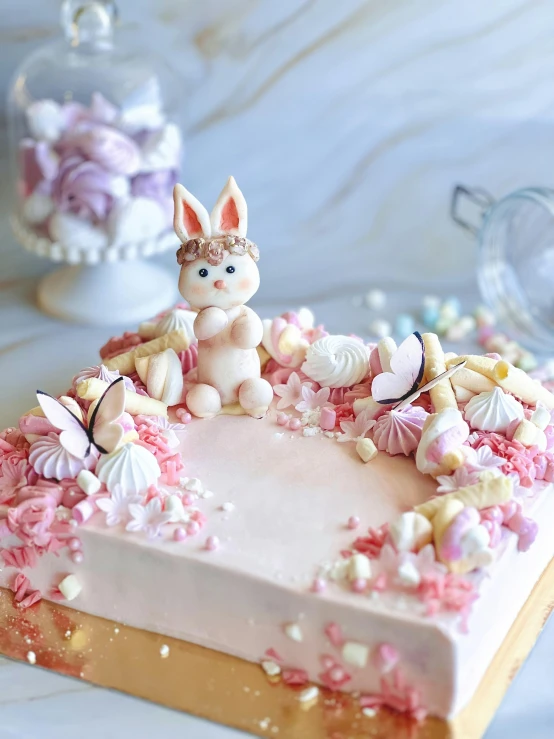 a bunny is laying in the center of a cake